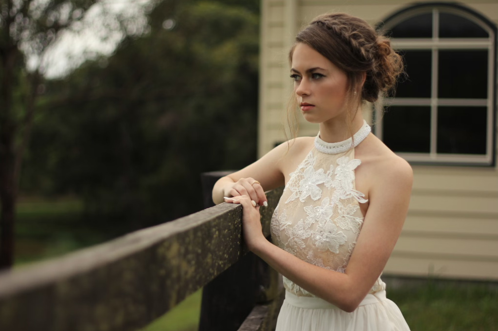 A bride wearing a beautiful wedding gown.