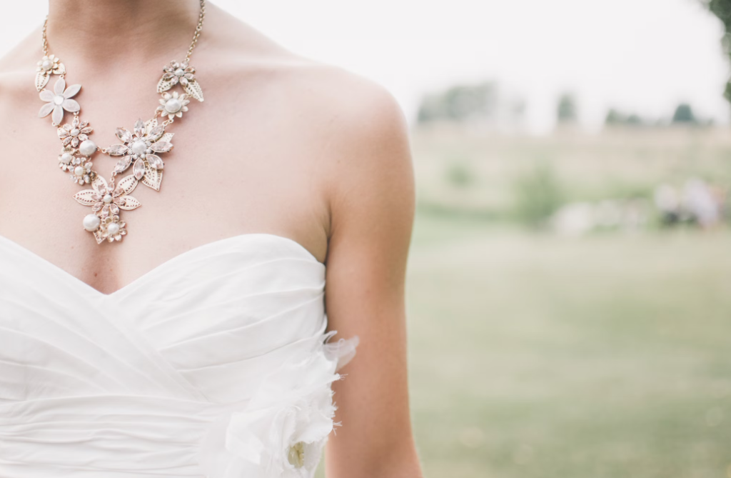 A petite woman wearing a wedding dress.