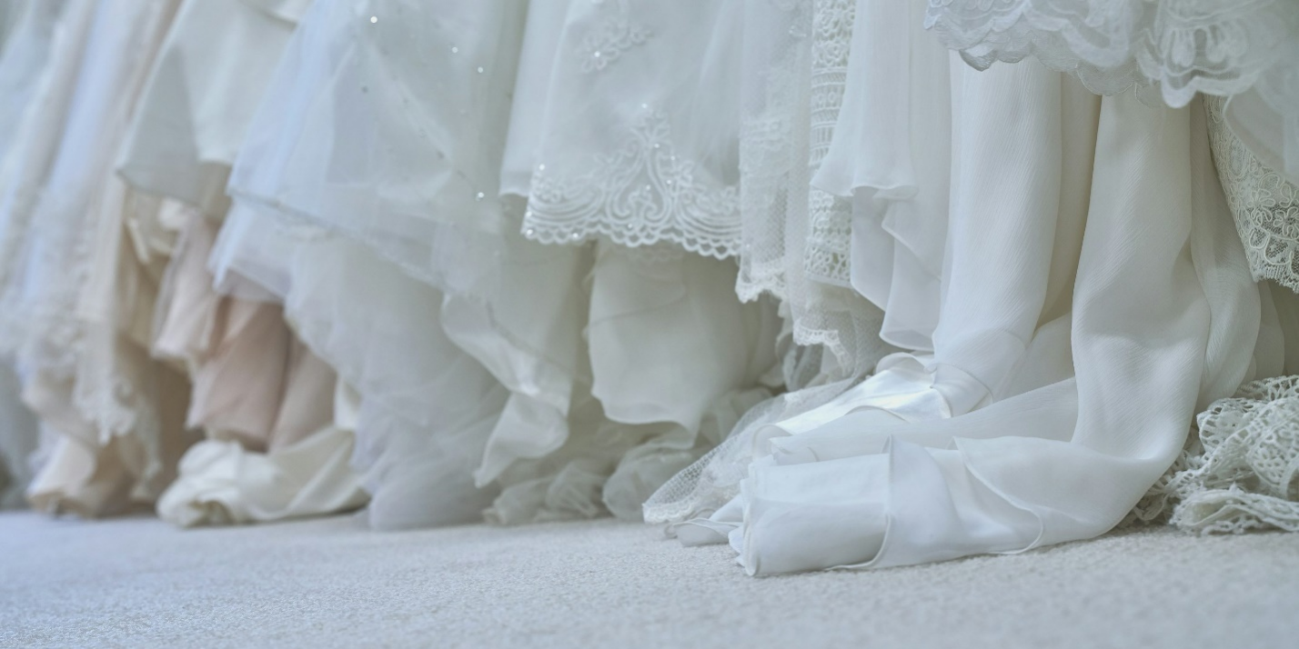 white wedding gowns next to each other